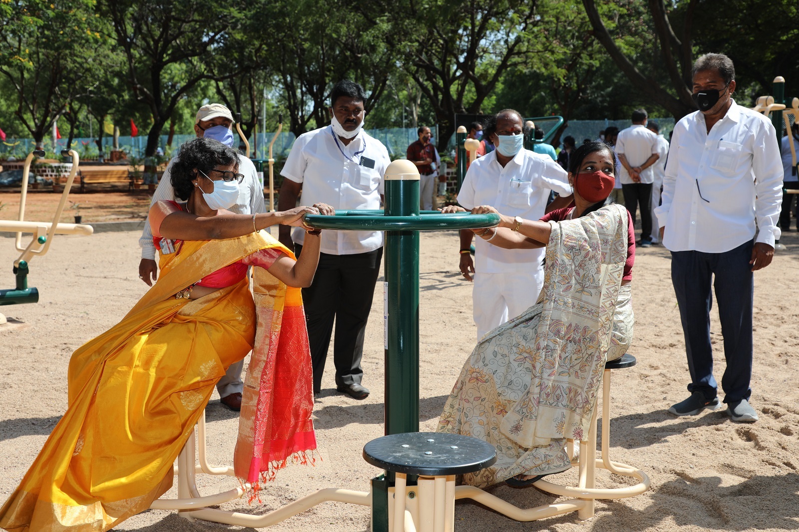 Smt M Rajasri, DGM, MS and Smt Malini Suresh, JC(F&A) are practicing at seated twister.