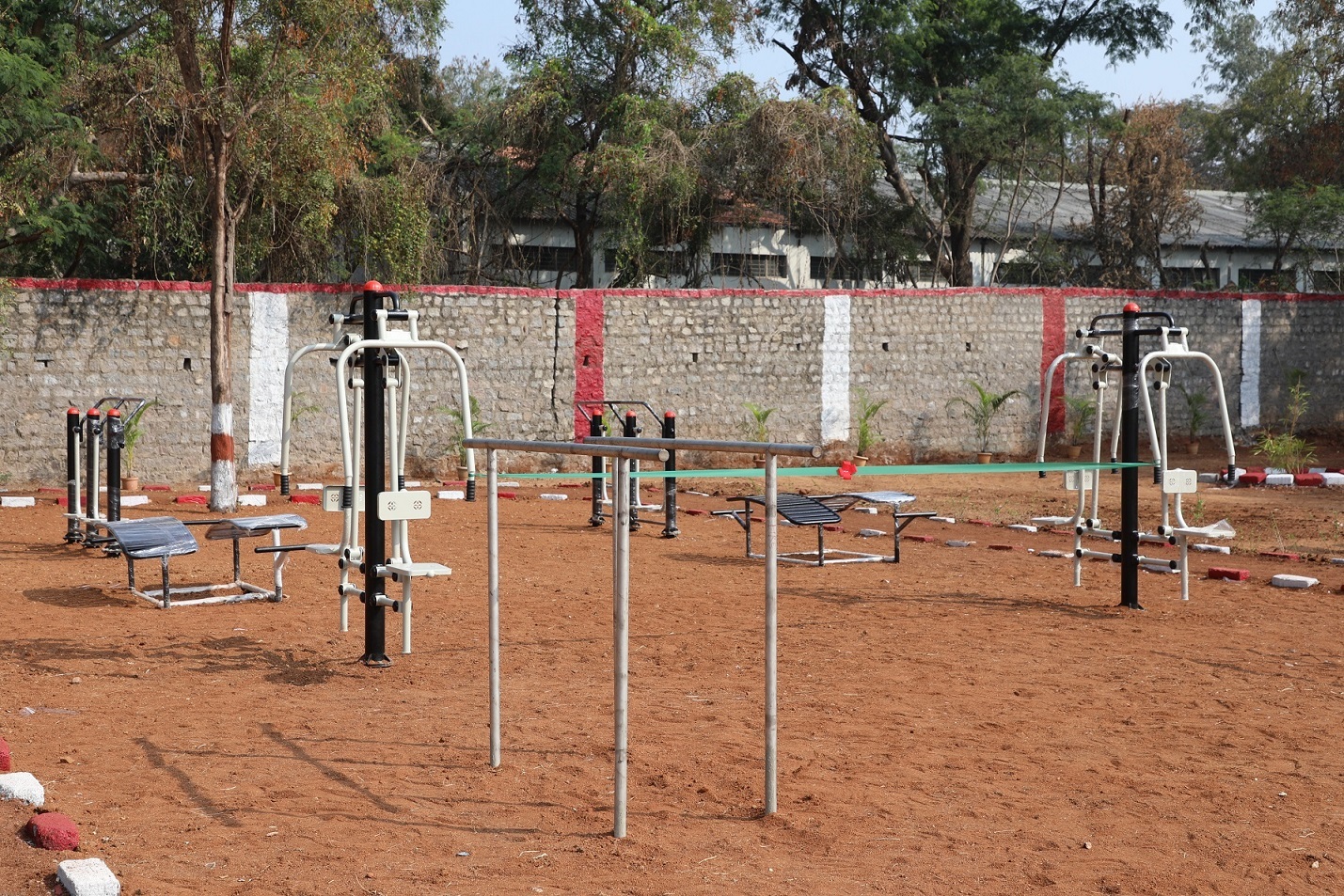 Newly installed outdoor exercise equipment in the ground.