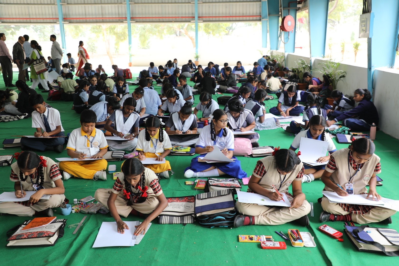 School Children participating in Drawing Competition