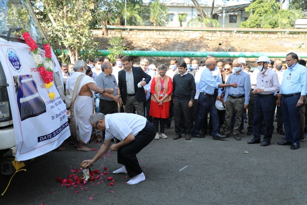 Dr Madan Gopal Krishnan, Director Material Group, BARC breaking coconut.