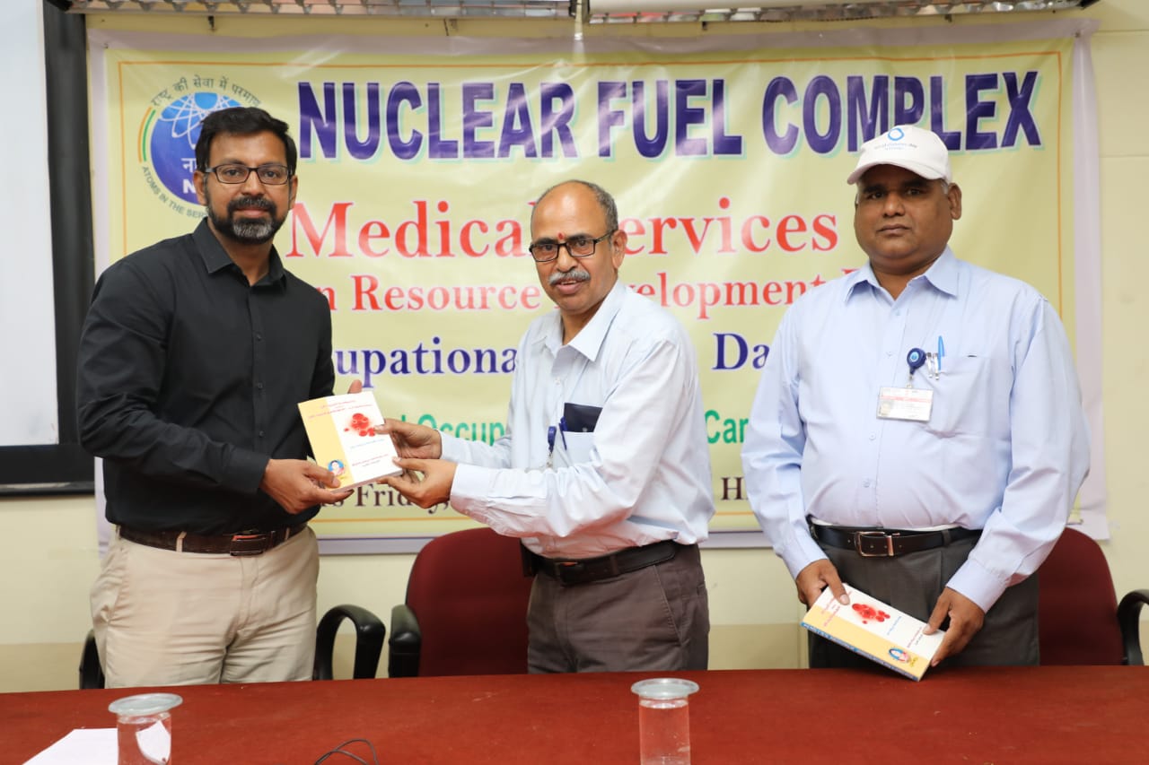 Dr.L. Arun Kumar Consultant Orthopaedic Surgeon receiving a book from Chief Guest.