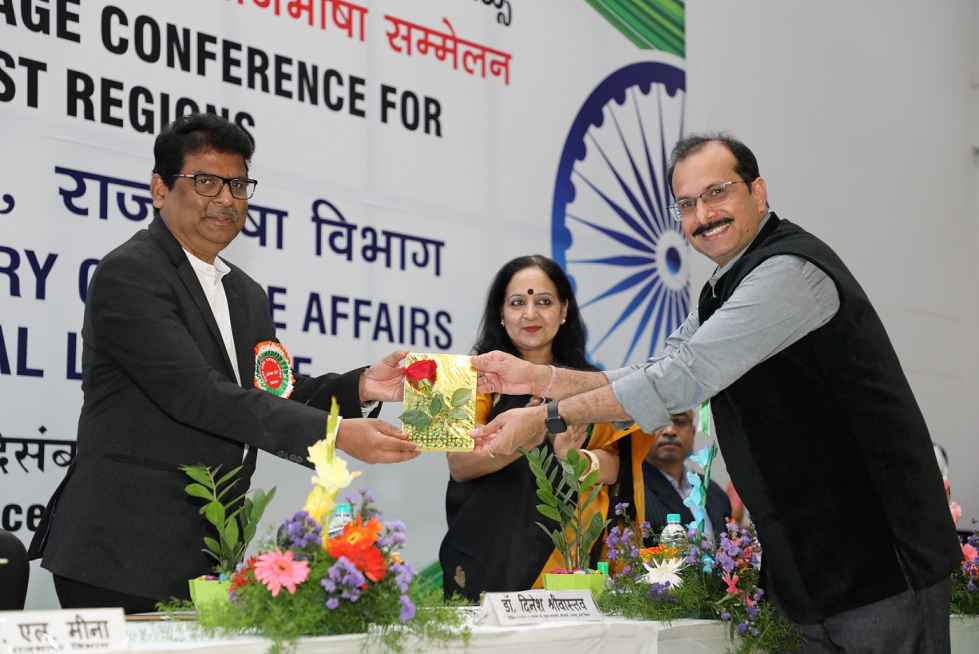 Dr. Dinesh Srivastava, Chairman & Chief Executive, NFC, receiving a book