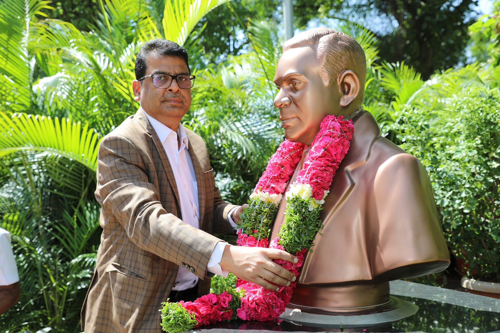 Garlanding the bust of Dr. N. Kondal Rao, Former CE, NFC (1975-1984) by Dr. Dinesh Srivastava, CE, NFC.