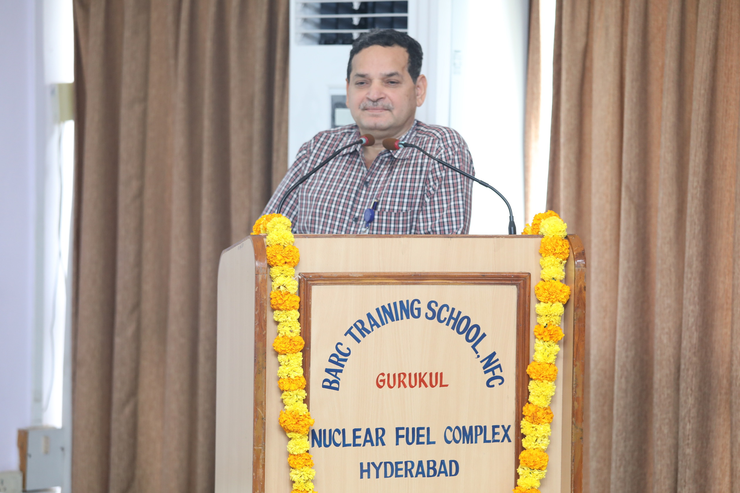 Shri R K Gupta, ED (QA), NPCIL delivering the talk.