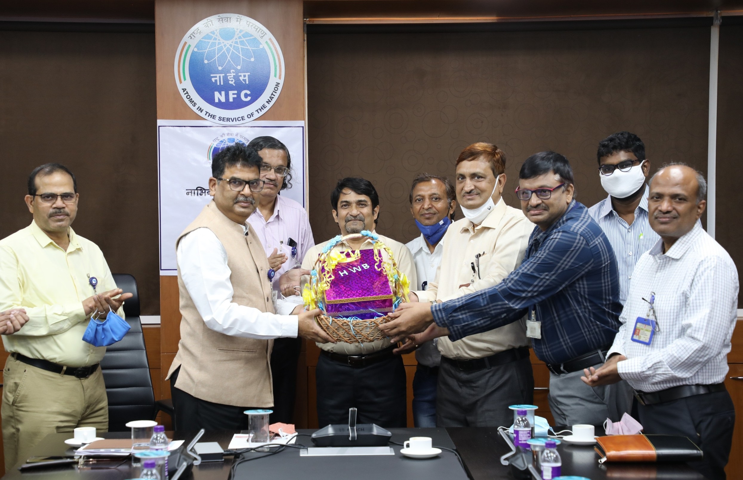 Dr. Dinesh Srivastava, Chairman  & CE, NFC receiving Boron Carbide Pellets from Officials of HWP, Manuguru.