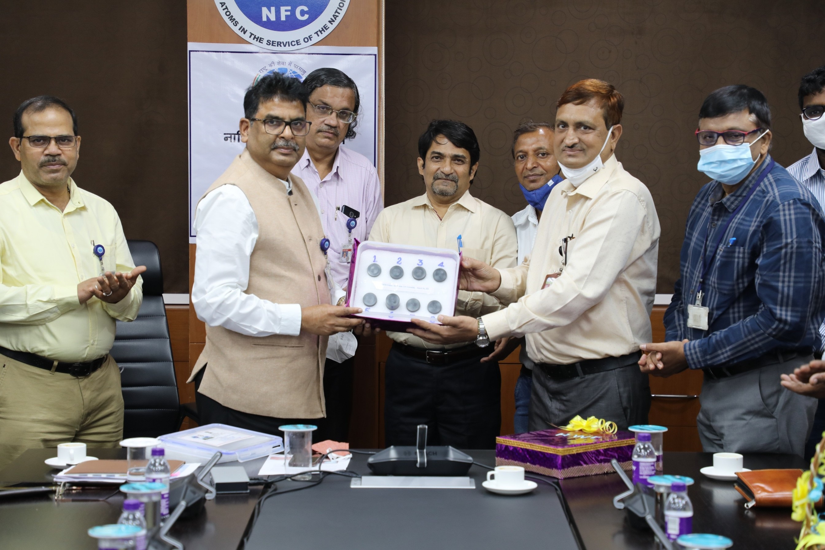 Dr. Dinesh Srivastava, Chairman  & CE, NFC receiving Boron Carbide Pellets from Officials of HWP, Manuguru.