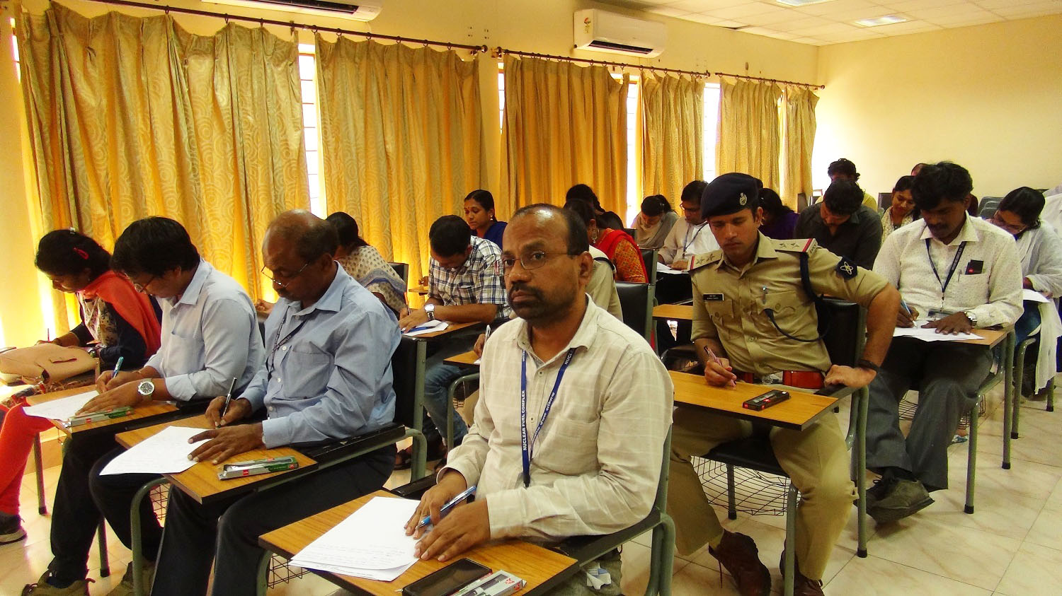 Employees participating in Essay Writing Competition.