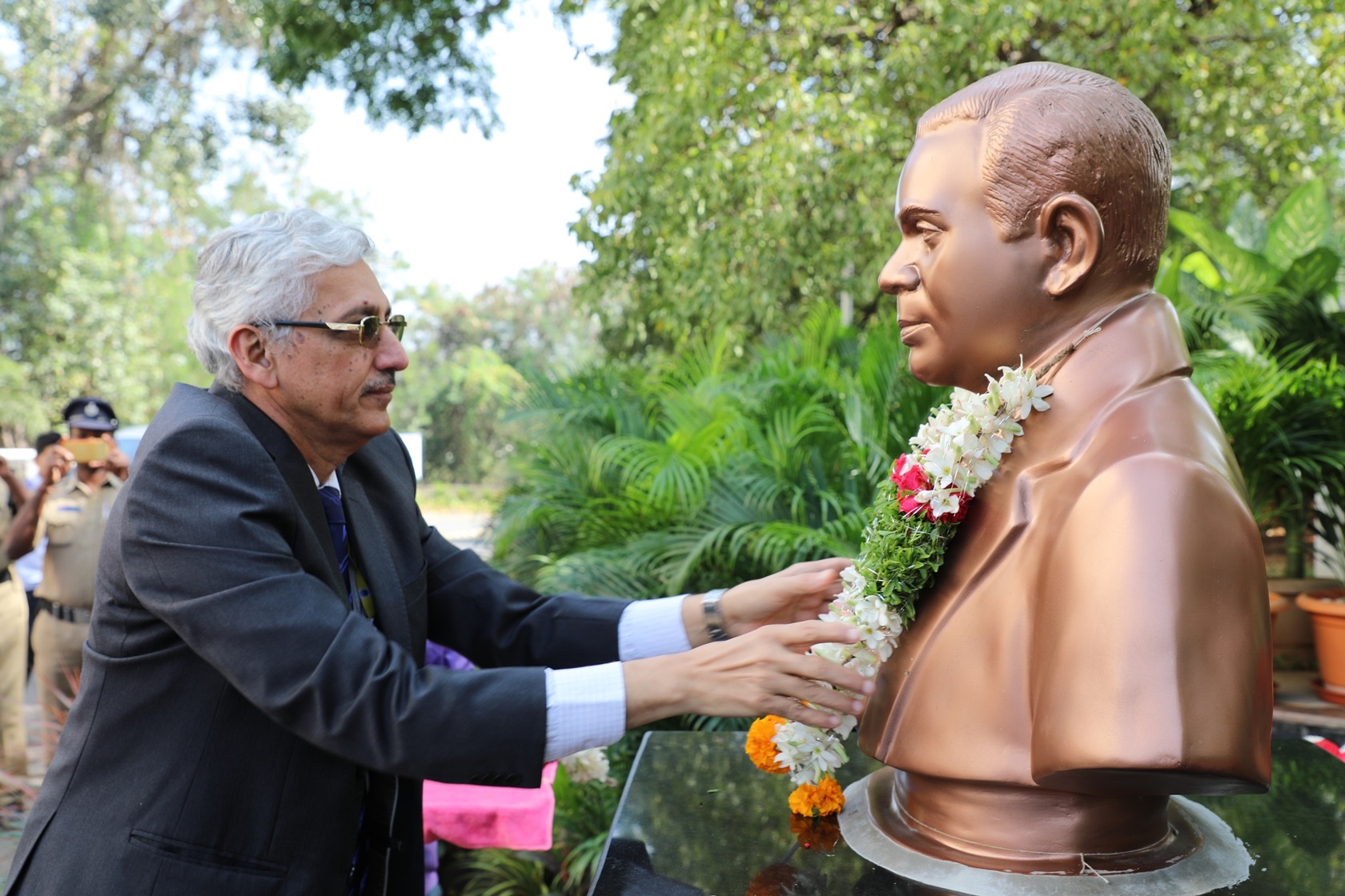 Floral tributes to the bust of Dr. N. Kondal Rao.